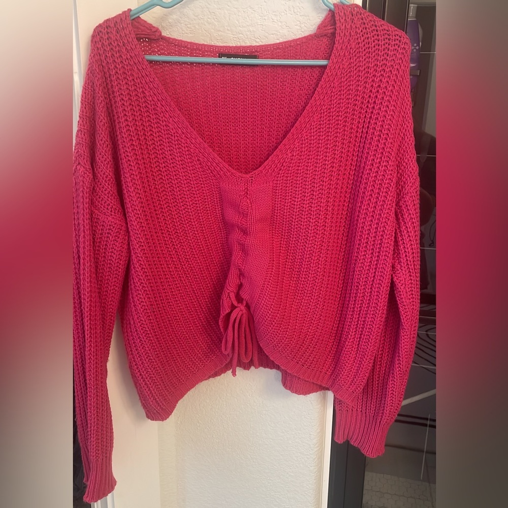 pink sweater with adjustable center to make more cropped